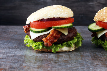 fresh tasty burger on wooden grey background