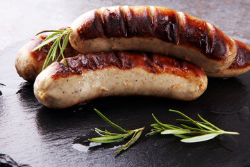 Grilled sausages with sauce ketchup on a wooden table - Home-made Pork Sausages