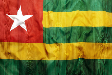 National flag of Togo, wooden background