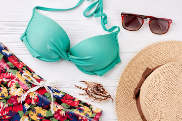 Feminine beach clothing close up. Summer holiday setting.