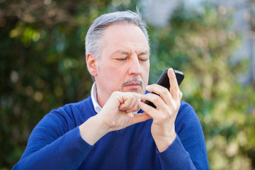 Senior man using his cell phone