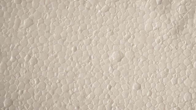 White polystyrene foam surface background texture. Dolly sliding shot 4K ProRes HQ codec