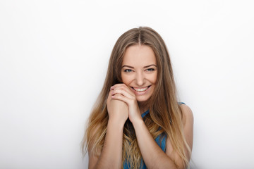Headshot of young adorable blonde woman with cute smile on white background
