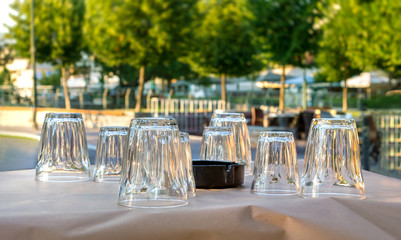 Greek tavern table with glasses.