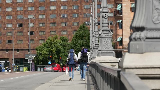 Backpackers walking at the Vasabron is a bridge in Stockholm, Sweden