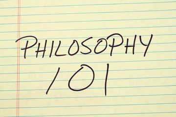 The words "Philosophy 101" on a yellow legal pad