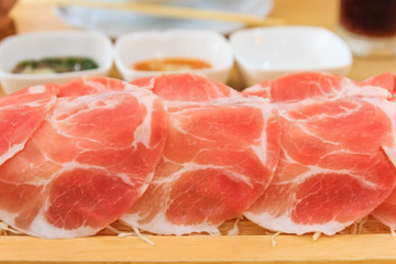 Shabu Shabu or Sukiyaki is a Japanese style and Korean style - Raw pork sliced for hot pot, Selective focus