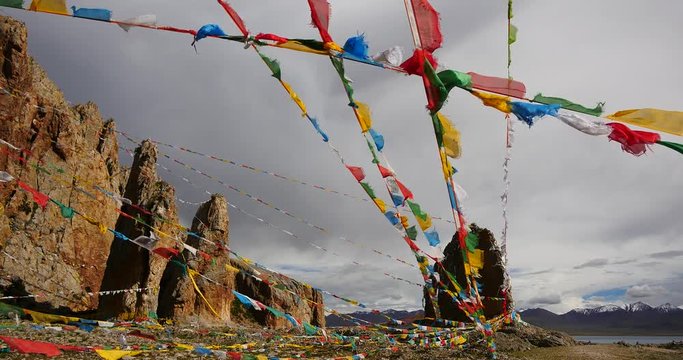 4k,Prayer flags at the lake namtso in tibet,ancient holy monk meditation in cave,tibet mansarovar,Tibet's second largest lake,the third largest saltwater lake in China,roof of the World.