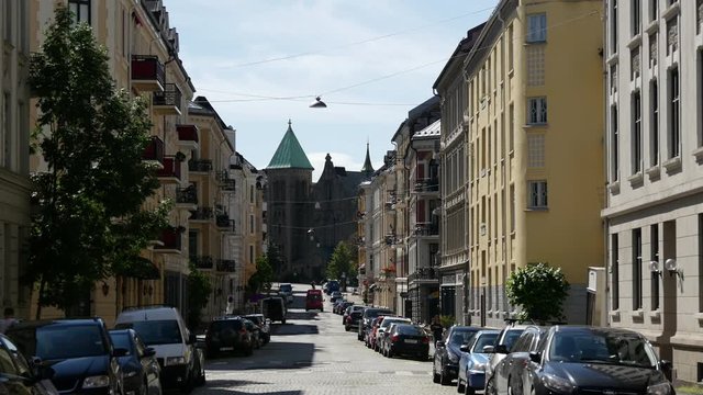 Street in Oslo with the Frogner Church in the background