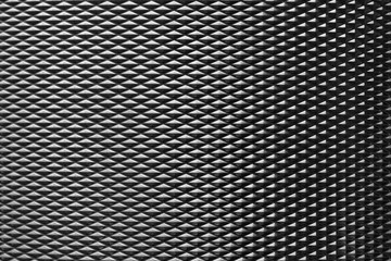 The diamond shape metal brush texture background in the dark scene. Metal  texture  background