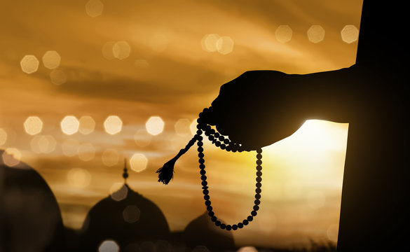 Silhouette Muslim Man Praying With Prayer Beads