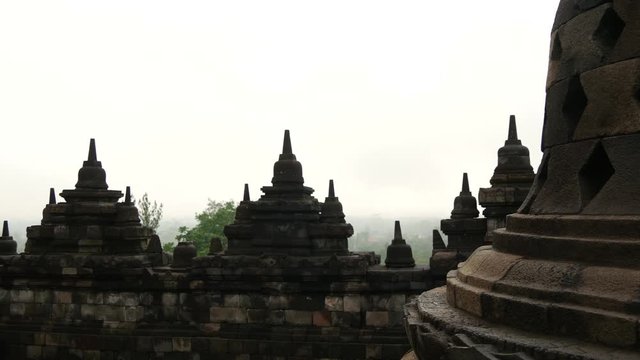 Tourists walking down the stairs at the Borobudur a 9th-century Mahayana Buddhist Temple in Magelang, Central Java, Indonesia