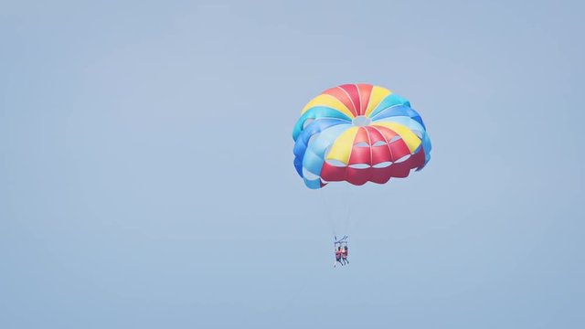 Pair of Tourists Parasailing off Maafushi Island