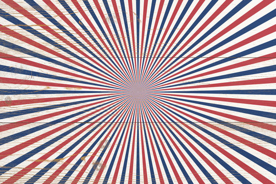 wooden planks painted with red and blue radial stripes