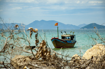 Colorful fishing boats in Vietnam, next to the fishing village.