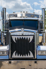 Head on view of big rig truck with teeth on the grille © Kristen