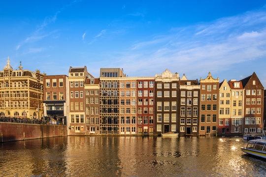 Amsterdam city skyline at Damrak canal waterfront, Amsterdam, Netherlands