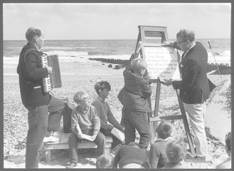 Religious service being held on a beach. Date: circa 1965