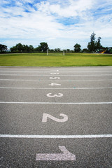 Gray treadmill at the stadium with the numbering from one to eight