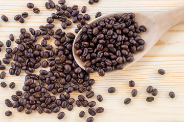 Cup and coffee beans on wooden