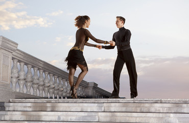 Pair of dancers dancing ballroom