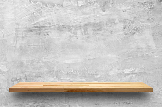 Empty Wood Shelf On Bare Concrete Wall Background