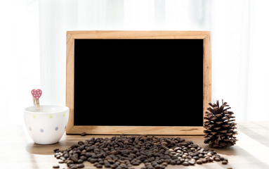 Blank blackboard with coffee mug and coffee beans decoration