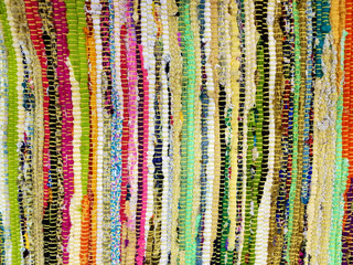 close up of colorful woven fabric strips