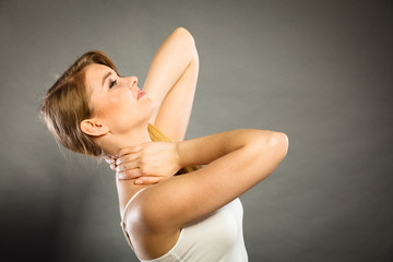 Woman suffering from neck pain
