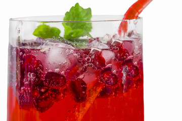 Cold saturated useful pomegranate juice in a glass close
