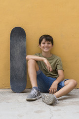 Young urban skater smiling 