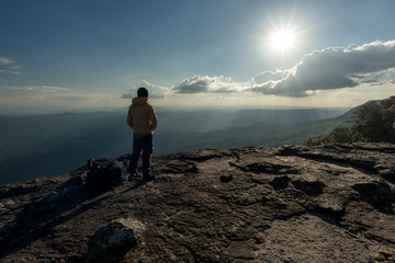 Man hikers tourist standing at the summit climber