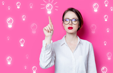 puzzled businesswoman with abstract lamps