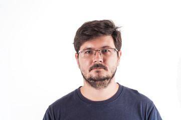 Fototapeta premium Caucasion man with glasses, beard and Disheveled hair look into camera