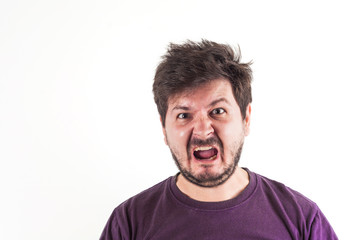 Screaming and angry face of 30 years old man in dark red t-shirt