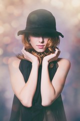 young redhead woman in black dress