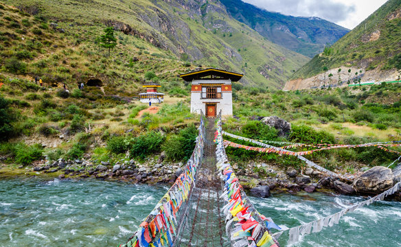 Fototapeta Iron Chain Bridge of Tachog Lhakhang Monastery, Paro River, Bhutan