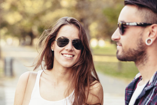 Portrait of young couple with sunglasses