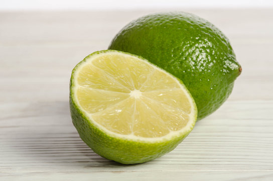Juicy lime on wooden table