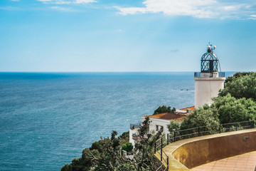 Fototapeta na wymiar View on the lighthouse Far de Sant Sebastia, Costa Brava, Spain