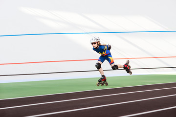Rollerskater little girl in track speedskating