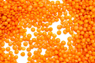 Red lentils on a white background