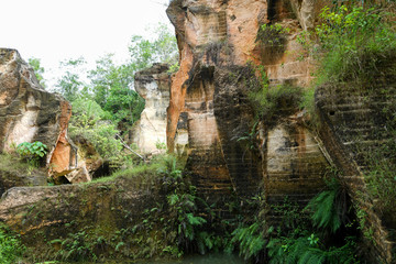 The exploitation of limestone hills canyon forming a unique architectural in Arosbaya Hill Madura...