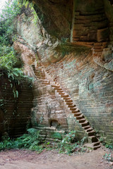 Stairs entrance or exit to the old historic limestone mine cave canyon in Arosbaya madura indonesia