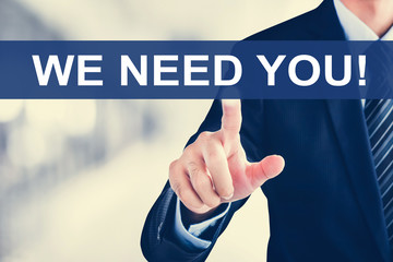 Businessman hand touching WE NEED YOU! message on virtual screen