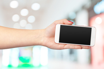 Mock up smartphone with blank screen in woman hands