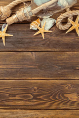 Seashells border on wood. Marine background