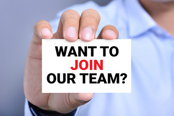 WANT TO JOIN OUR TEAM? message on the card shown by a man