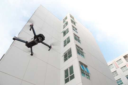 Drone Flying Over On Building Background.