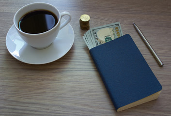Coffee, notepad and money